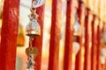 Golden brass bell hanging on the temple fence Royalty Free Stock Photo