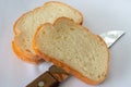 Golden bread sliced with a knife