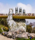 Golden Bridge supported by a pair of giant hands