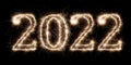 Golden bright sparkler number 2022 isolated  black. happy new year eve celebration background Royalty Free Stock Photo