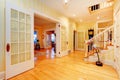 Golden bright yellow luxury home main hallway, entrance with staircase. Royalty Free Stock Photo