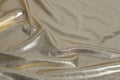 Golden brocade fabric waves Royalty Free Stock Photo