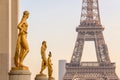 Golden bronze statues on Trocadero square, Eiffel tower, Paris France