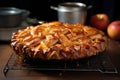 golden brown apple pie cooling on a wire rack