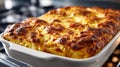 Golden-brown baked lasagna in a white casserole dish. Royalty Free Stock Photo