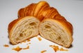 Golden brown butter croissant with shadow  on the plain background. Royalty Free Stock Photo