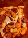 Golden brown potatoes frying in butter