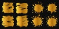 Golden brush strokes and paint blots. Vector set Royalty Free Stock Photo
