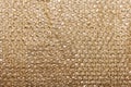 Golden bubble plastic wrapping decorative background Royalty Free Stock Photo