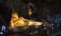 The golden Budda statue in the cave of Wat Tham Suwan Kuha cave. 22 December 2018 Royalty Free Stock Photo