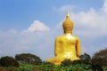 Golden Buddha with blue sky. Royalty Free Stock Photo