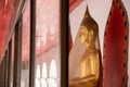 Golden Buddha in cover with plastic wrap at Poramai Yigawat Temp