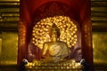 Golden Buddha is enshrined in a Samadhi glass wood arch. Royalty Free Stock Photo