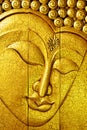 Golden buddha face made by carving wood Royalty Free Stock Photo
