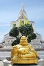 Golden Buddha in front of Wat Arun, the beautiful white Buddhist temple in Bangkok, Thailand Royalty Free Stock Photo