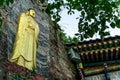 Golden Buddha image statue craft on the rock cliff in Gujoel Pokpoam hermitage in Oegok city