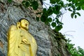 Golden Buddha image statue craft on the rock cliff in Gujoel Pokpoam hermitage in Oegok city