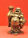 Golden Buddha on a red background Royalty Free Stock Photo