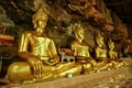 Golden buddha sculpture in cave