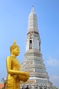 Golden Buddha standing in front of Wat Arun or the Temple of Dawn, Bangkok, Thailand Royalty Free Stock Photo