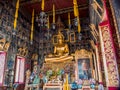 Golden Buddha statue with ancient mural painting around. Royalty Free Stock Photo