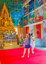 Golden buddha statue art paintings Wat Plai Laem temple Thailand