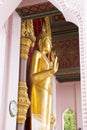 Golden Buddha statue at the entrance