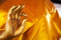 Golden Buddha statue hand gesture close-up with copy space Royalty Free Stock Photo