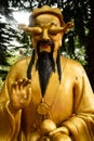 Golden Buddha statue with hands in the eyes in Ten thousand Buddhas Monastery in Hong Kong, China Royalty Free Stock Photo