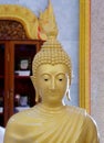 Close-up photography of statue of Golden Buddha in the temple. Royalty Free Stock Photo