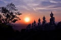 The golden Buddha statue of Phu Salao temple in beautiful sunset moment at Pakse