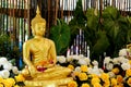 Golden buddha statue for pour watering on songkran day