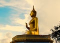 Golden buddha statue with a spectacular of clouds and sky backgr Royalty Free Stock Photo