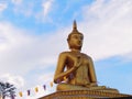 Golden buddha statue with a spectacular of clouds and sky backgr Royalty Free Stock Photo