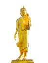 Golden Buddha statue standing with yellow flower garland on its left hand isolated on white background. Royalty Free Stock Photo