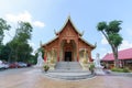 Golden buddha statue and stupa in a temple in Chiang Rai