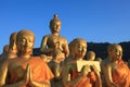 golden buddha statue in temple with beautiful morning light against blue sky use for multipurpose in religion theme