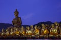 golden buddha statue in temple with beautiful with star tail against blue night sky