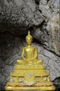 Golden buddha statue at Tham Pu Wa temple Kanchanaburi, Thail Royalty Free Stock Photo