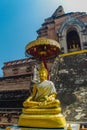 Golden Buddha statue on top of the old pagoda at Wat Chedi Luang temple of the big royal stupa, located in Chiang Mai, Thailand. Royalty Free Stock Photo
