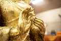 The golden Buddha statue.View of buddha statue in Thailand.Close up hand of statue Buddha.buddhism concept
