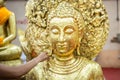 The golden Buddha statue.View of buddha statue in Thailand.Close up hand of statue Buddha.buddhism concept