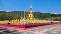 The golden Buddha statue was built outdoors. It is a symbol of the Wednesday religion