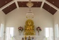 Golden buddha statue in white church Royalty Free Stock Photo