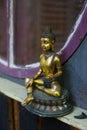 Golden buddha statue on wooden colorful background Royalty Free Stock Photo