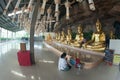 Golden Buddha statues in a cave at Buddhist temple.