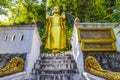 Golden buddha statue Phousi Hill Wat Chom Si Luang Prabang