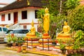 Golden Buddha statues in Louangphabang, Laos. Copy space for tex Royalty Free Stock Photo