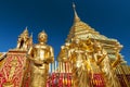 Golden Buddha statues and a golden pagoda or Chedi, Wat Phra That Doi Suthep, Chiang Mai, Thailand Royalty Free Stock Photo