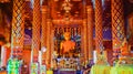 The golden buddha in a thai temple ,church of temple, colorful picture style, selective focus on image of buddha